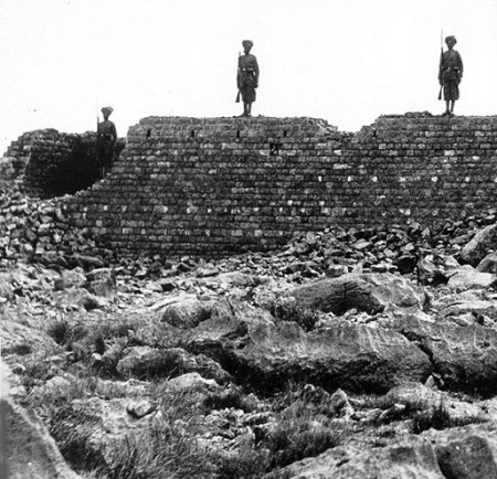 Soldiers of the 36th Sikhs stand on the wall of the ruined building of Saragarhi which was burnt by Pathan tribesmen. All 21 of their colleagues die